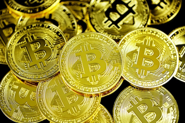 Pile of Bitcoins on a black surface
